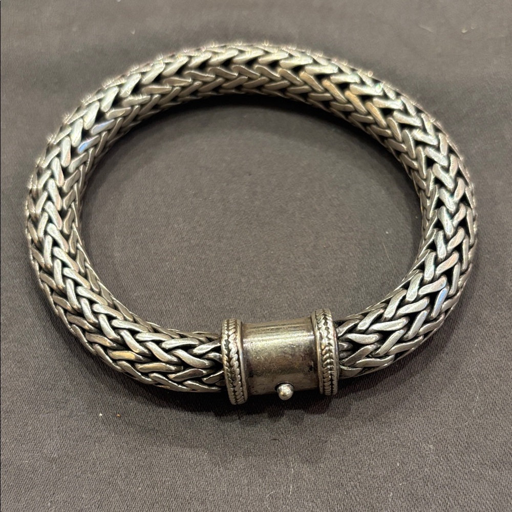 Heavy silver bracelet.